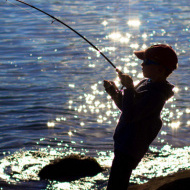 Boy fishing at a pond