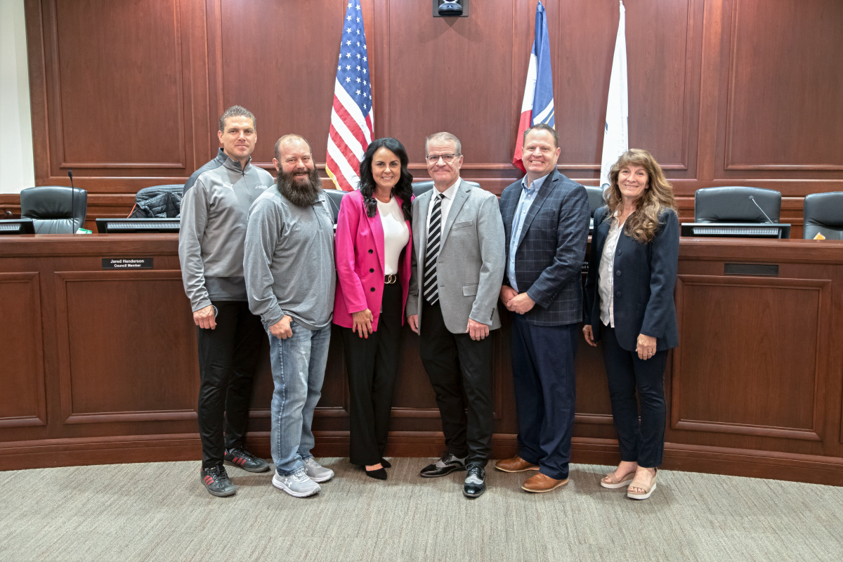 Herriman High School principal Todd Quarnberg stands with the Herriman City Council and Assistant City Manager as he is honored by the Council before his 2025 retirement.