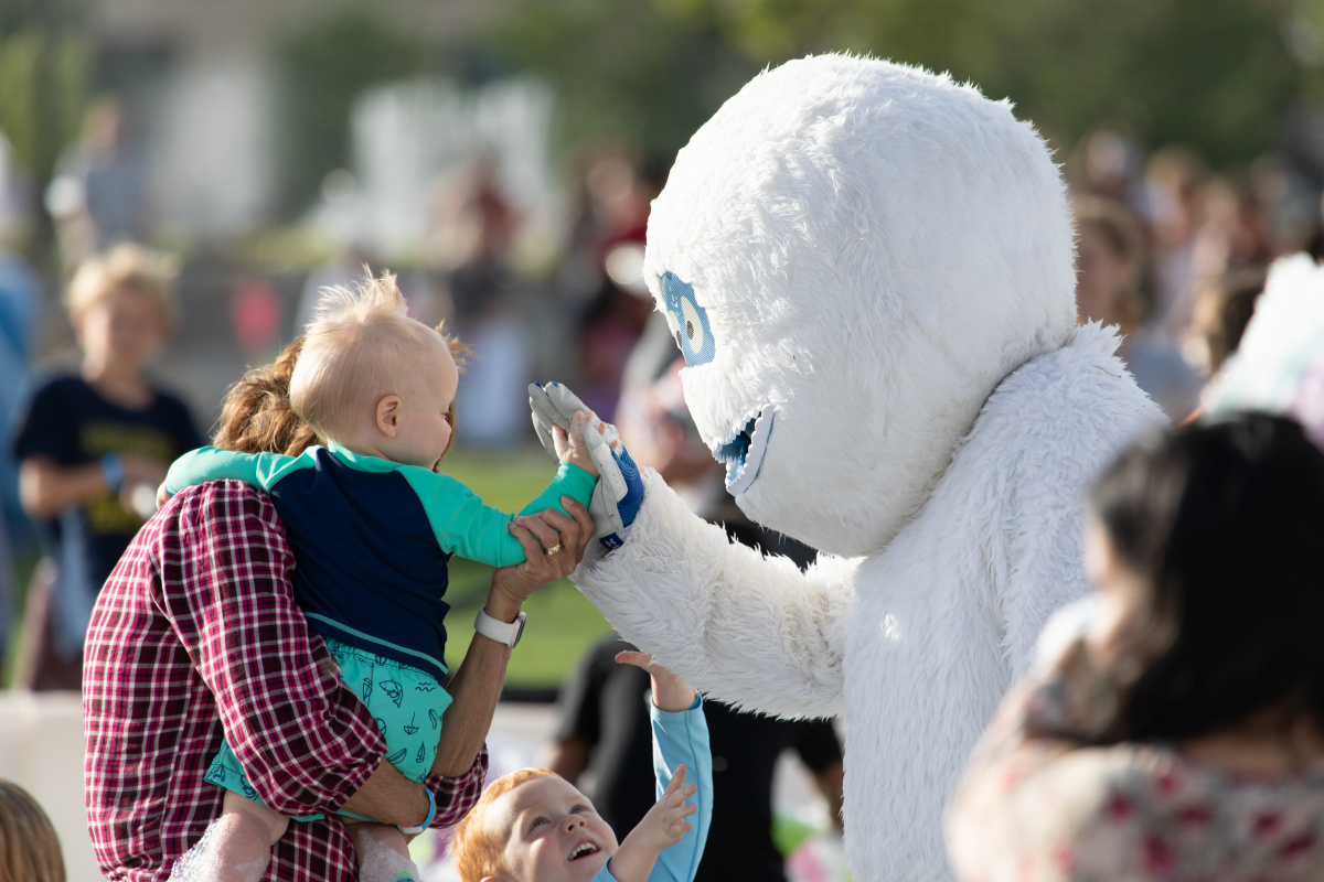 Herriman Yeti with children at a past foam party